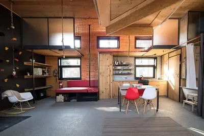 a room with a table and chairs in a room at Cabin Zoobox 66 in Eastman