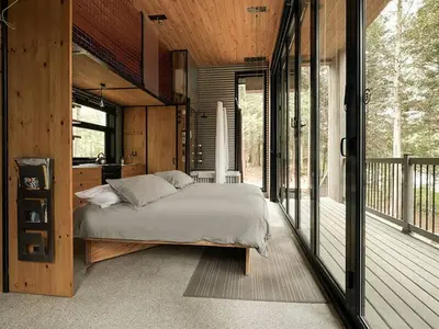 a bedroom with a large bed in a house at Cabin Zoobox 82 in Eastman
