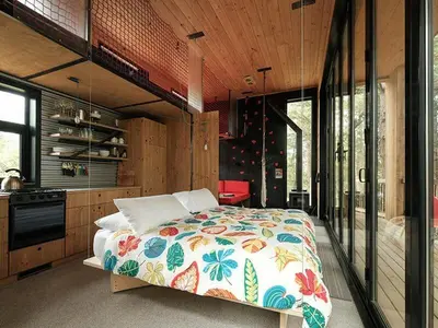 a bedroom with a large bed in a house at Cabin Zoobox 84 in Eastman