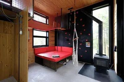 a red bench in the middle of a room at Cabin Zoobox 84 in Eastman