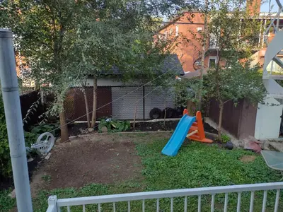 a playground with a slide in a yard at Smiling house! 2 chambres, accueillant et spacieux in Montréal