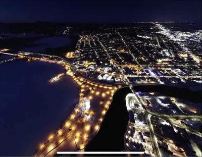 an aerial view of a city at night at Cap Magog! Près du lac Memphrémagog et Mont Orford in Magog-Orford