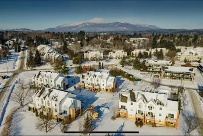 an aerial view of a town in the snow at Cap Magog! Près du lac Memphrémagog et Mont Orford in Magog-Orford
