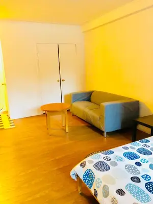 a living room with a couch and a table at Stylish Montreal Apartment: Comfortable Stay in the Golden Square Mile in Montréal