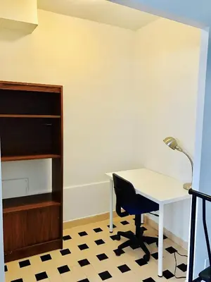 a desk and a chair in a room at Stylish Montreal Apartment: Comfortable Stay in the Golden Square Mile in Montréal