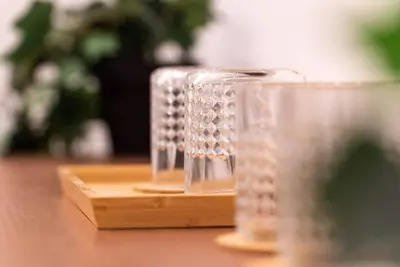 a group of glasses sitting on top of a table at Downtown Prestige: Parking, King Bed, Sleeps 6 in Sherbrooke