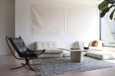 a living room with a couch and a chair at Appartement de luxe avec piscine in Montréal