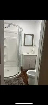 a bathroom with a shower and a toilet and a sink at Self-service small breakfast private Room 1 in Montréal