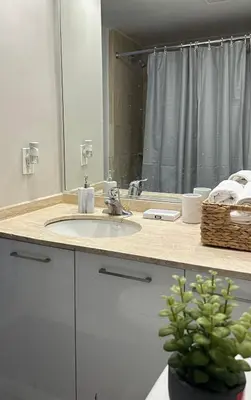 a bathroom counter with a sink and a mirror at Hello,CRESCENT in Montréal