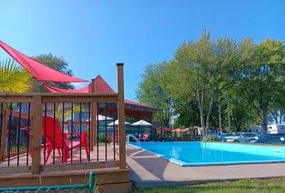 a swimming pool with a gazebo next to a pool at Loft in Louiseville