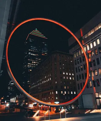 a large red circle in front of a building at night at Cozy 1BR in Vieux-Longueuil +parking 14min Downtown in Longueuil