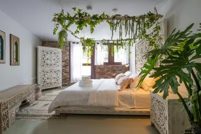 a bedroom with a bed and a plant in it at Exclusive 6 bed, 6 bath residence in Old Montreal in Montréal