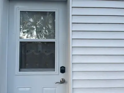 a white door with a window on a house at Basement 2-bedroom apartment near National Park and Montréal in Saint-Bruno-de-Montarville