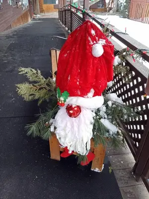a santa claus hat sitting on a bench at Motel Lennoxville in Sherbrooke
