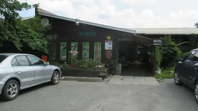 a car parked in front of a petrol station at Motel Lennoxville in Sherbrooke
