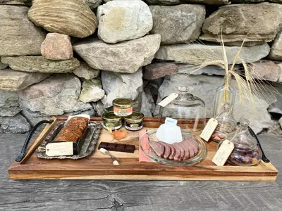 a tray with different types of food on it at Eco Lodge Bûcheron Bergère in Ormstown