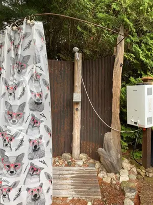 a curtain with a wolf pattern on it next to a fence at Eco Lodge Bûcheron Bergère in Ormstown