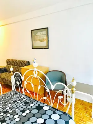 a living room with a couch and chairs in it at Stylish Montreal Apartment: Comfortable Stay in the Golden Square Mile in Montréal