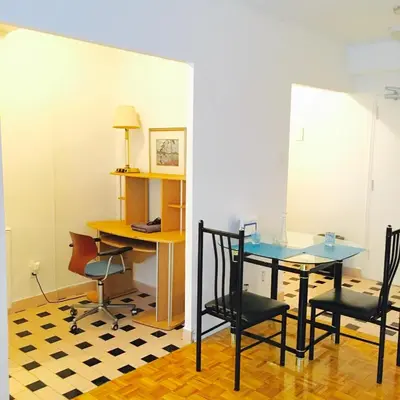 a dining room with a glass table and chairs at Stylish Montreal Apartment: Comfortable Stay in the Golden Square Mile in Montréal