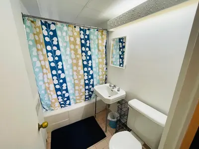 a bathroom with a toilet and a sink at Stylish Montreal Apartment: Comfortable Stay in the Golden Square Mile in Montréal