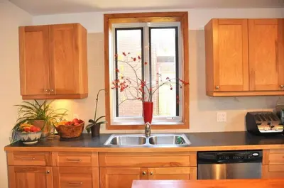 a kitchen with a sink and a window at Le Tierra del Fuego by HomeInMontreal in Montréal