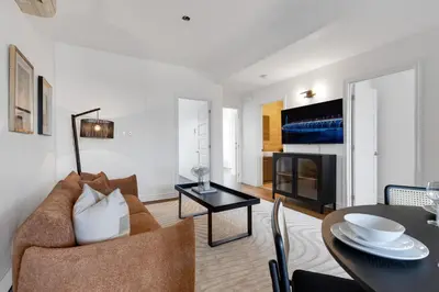 a living room with a couch and a table at Lofts de la petite Italie in Montréal