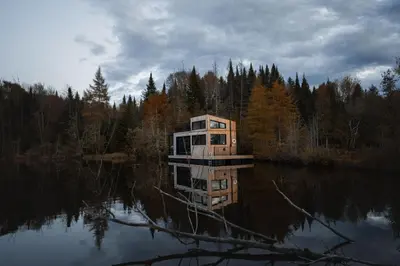 a house in the middle of a body of water at MiniBora Le lichen - Cantons-de-l'Est in Bury