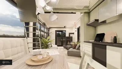 a kitchen and living room with a table at MiniBora Le lichen - Cantons-de-l'Est in Bury
