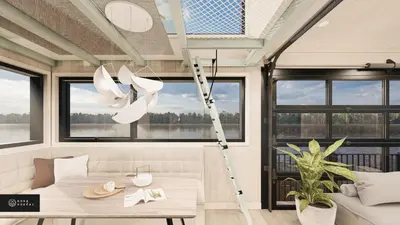 a room with a table and a ladder at MiniBora Le ciel - Cantons-de-l'Est in Bury