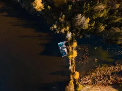 an aerial view of a house in the water at MiniBora Le moka - Cantons-de-l'Est in Bury