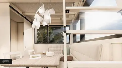 a dining room with a table and a window at MiniBora Le cumulus - Cantons-de-l'Est in Bury