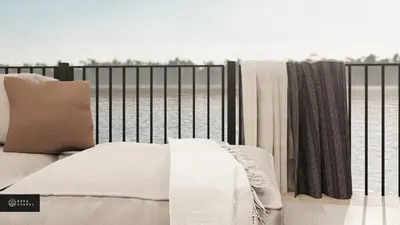 a bed sitting on top of a iron fence at MiniBora Le cumulus - Cantons-de-l'Est in Bury