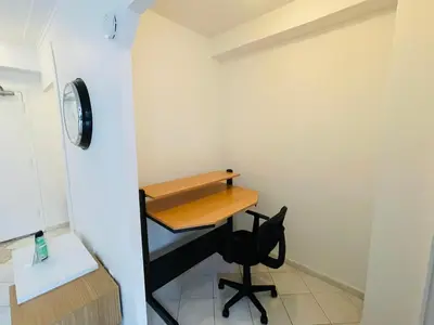 a small office with a desk and a chair at Stylish Montreal Apartment: Comfortable Stay in the Golden Square Mile in Montréal