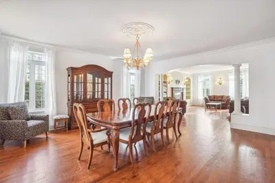 a dining room with a table and chairs at Private Waterfront Villa 9 BR Peaceful in Laval