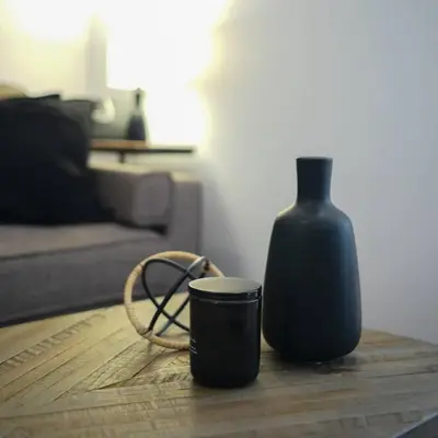 a vase and a cup on a table in a living room at HRésidences Modern Condo on MAIN St Laurent Blvd in Montréal