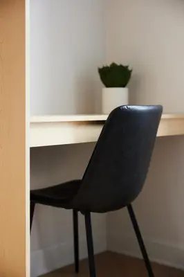 a black chair sitting in front of a desk at Chic 2 Bedroom apartment in Le Plateau by Denstays in Montréal