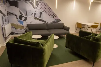 a living room with two couches and a couch and a table at Downtown Montreal Premium Cozy Studio in Montréal