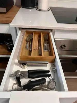 a drawer filled with utensils in a kitchen at Downtown Montreal Premium Cozy Studio in Montréal