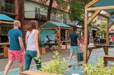 a group of people walking around a playground at Chez Mont Royal Apartments! in Montréal