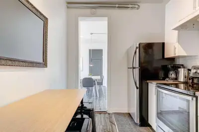 a kitchen with a wooden counter top in a room at Chez Mont Royal Apartments! in Montréal