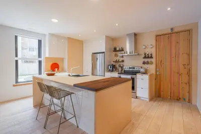 a kitchen with a large island with a counter top at Chez moi - Plateau - Superbe Stay - Excellent emplacement - très confortable in Montréal