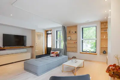 a living room with a couch and a tv at Chez moi - Plateau - Superbe Stay - Excellent emplacement - très confortable in Montréal