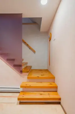 a staircase in a house with wooden steps at Chez moi - Plateau - Superbe Stay - Excellent emplacement - très confortable in Montréal