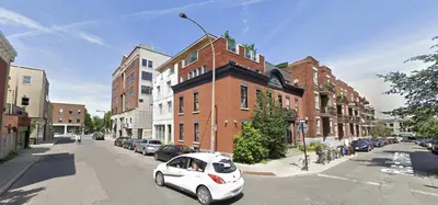 a white car parked on the street in a city at Chez moi - Plateau - Superbe Stay - Excellent emplacement - très confortable in Montréal