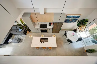 an overhead view of a living room with a table at Penthouse Downtown 2BR 2 BR Private Roof Terrace presented by TripMontreal in Montréal