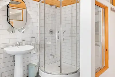 a bathroom with a glass shower and a sink at Magnificent 2BR Apartment fully equipped in Montréal