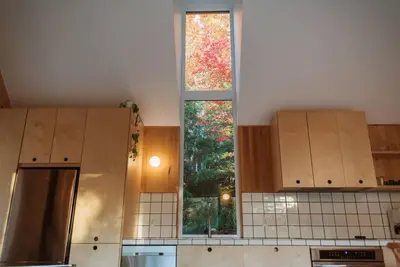 a kitchen with a window in the middle of it at Chez Pedro in Saint-Valère