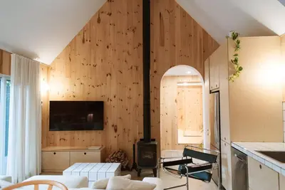 a living room with a couch and a fireplace at Chez Pedro in Saint-Valère