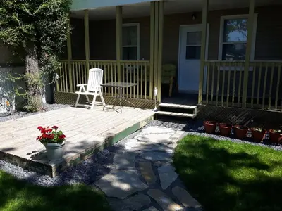 a chair sitting on a porch of a house at Appartement Cartier 2 in Longueuil