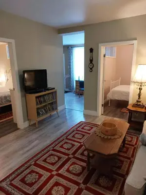 a living room with a couch and a tv at Appartement Cartier in Longueuil